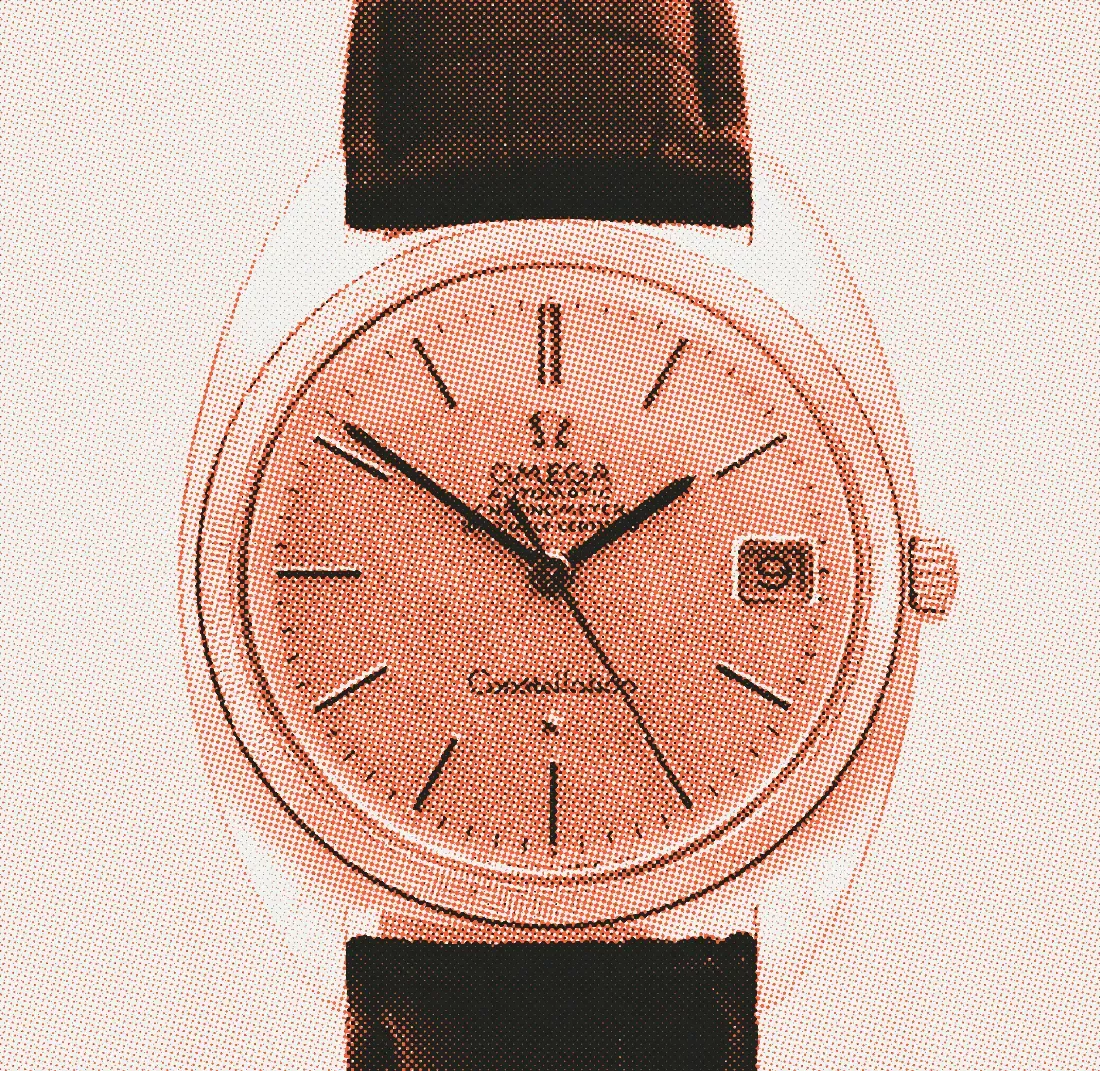 A gold Omega Constellation with a C-shaped cushion case, fluted bezel, linen dial and date window, on a black leather strap